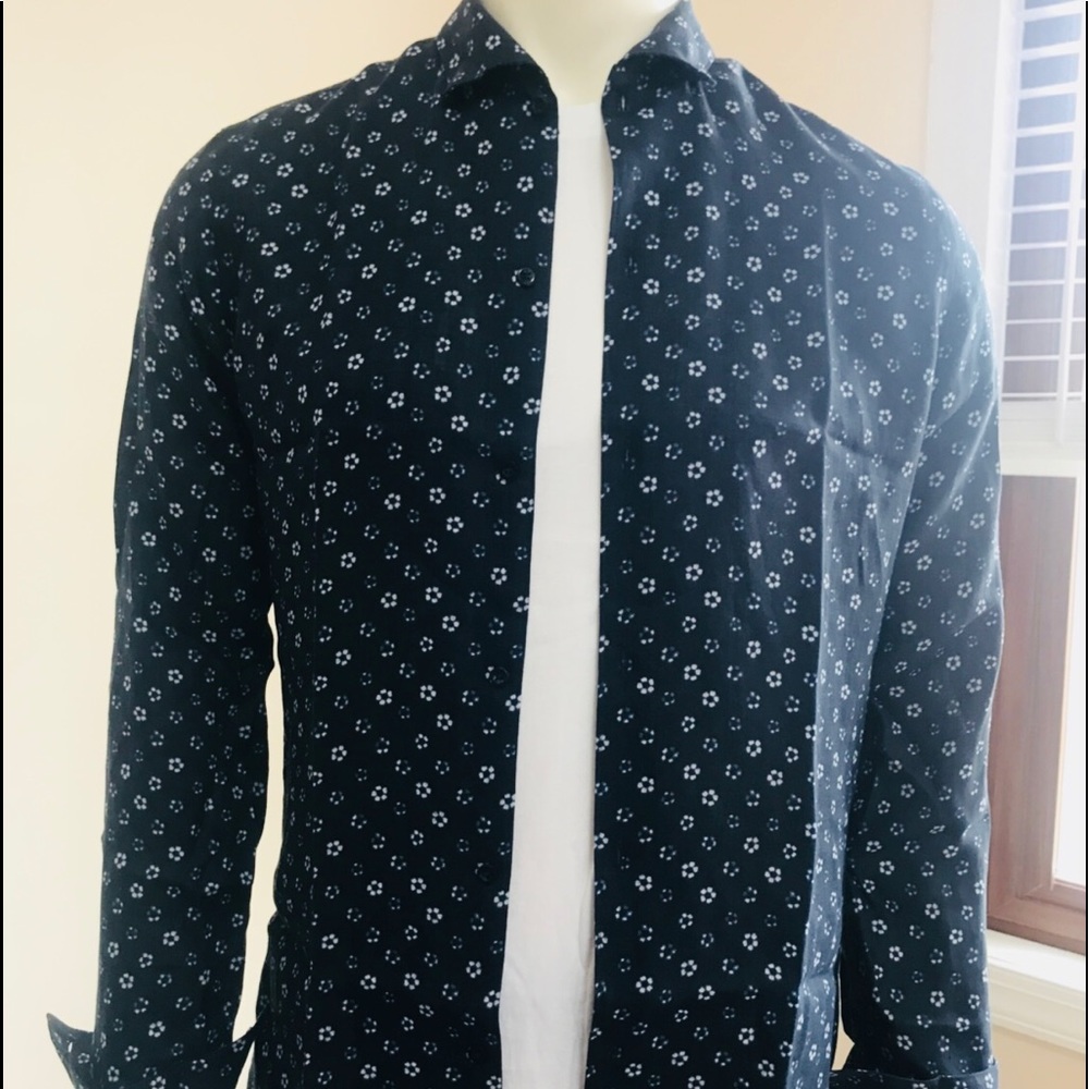 Navy blue shirt with floral micro patterns.